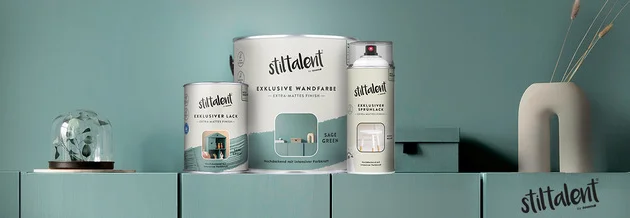 Drei Farbdosen in verschiedenen Größen